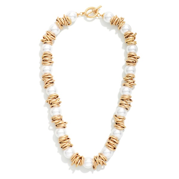 Beaded Necklace Featuring Pearl And Metal Rings Stations With Toggle Clasp 

-Approximately 16" L 