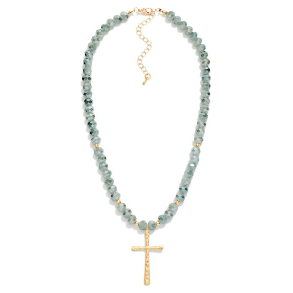 Faceted Glass Beaded Necklace With Cross Pendant  Featuring Gold Tones

- Approximately 20" L 