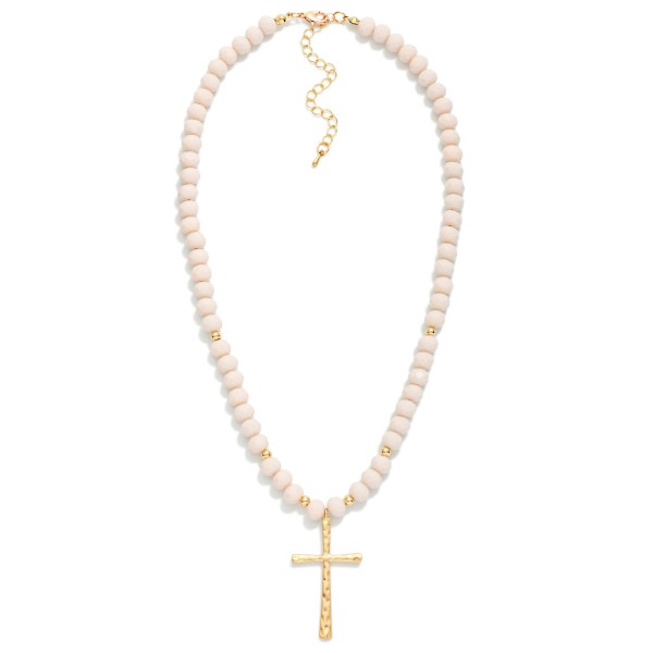 Faceted Glass Beaded Necklace With Cross Pendant  Featuring Gold Tones

- Approximately 20" L 