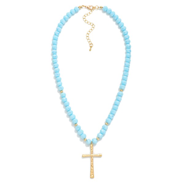 Faceted Glass Beaded Necklace With Cross Pendant  Featuring Gold Tones

- Approximately 20" L 