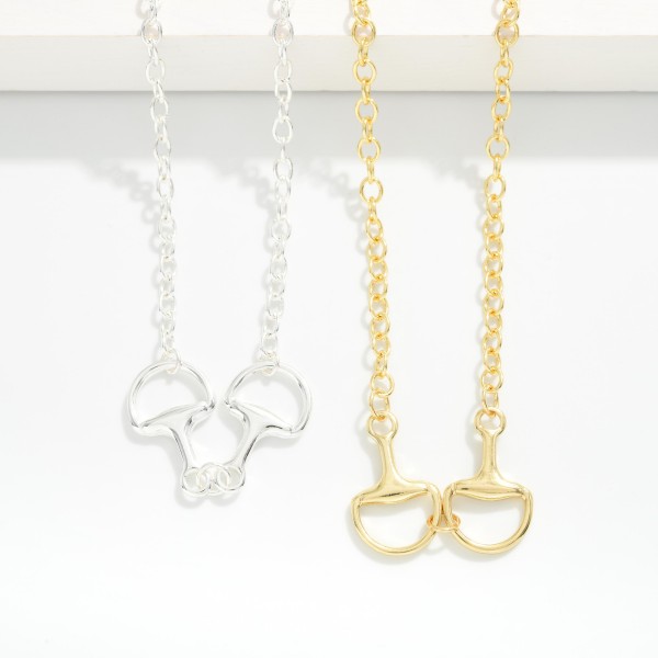 Chain Link Necklace Featuring Metal Tone Horsebit Pendant 

- Gold Dipped 
- Approximately 16" L