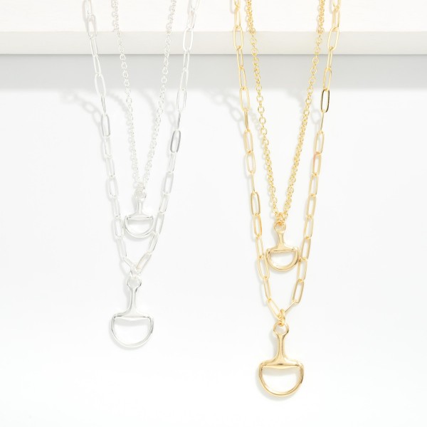 Layered Chain Link Necklace Featuring Horsebit Pendants

- Gold Dipped 
- Approximately 15" L
- Extender 3" L