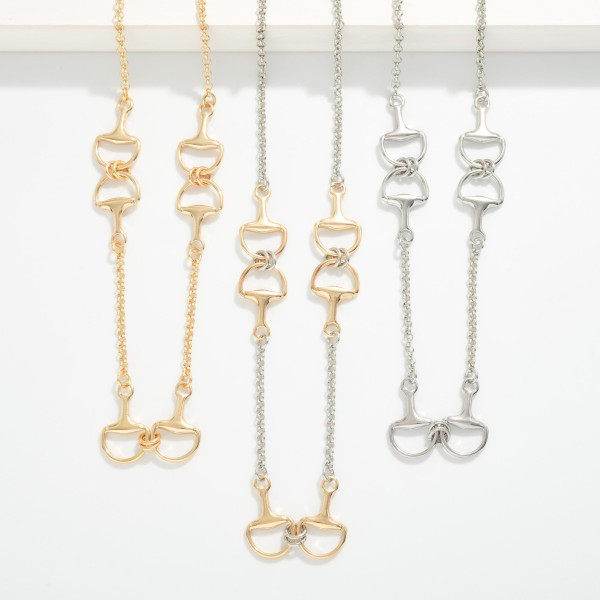 Metal Tone Chain Link Necklace Featuring Horsebit Stations 

- Approximately 18" L 
- Extender 3" L 
