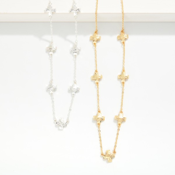 Metal Tone Dainty Chain Link Necklace Featuring Metal Plus Cross Stations 

- Approximately 14" L 
- Extender 2" L 