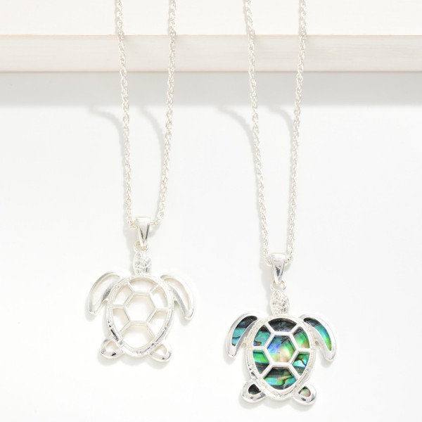 Twisted Metal Chain Link Necklace Featuring Metal Tone & Shell Turtle Pendant 

- Approximately 18" L
- Extender 3" L