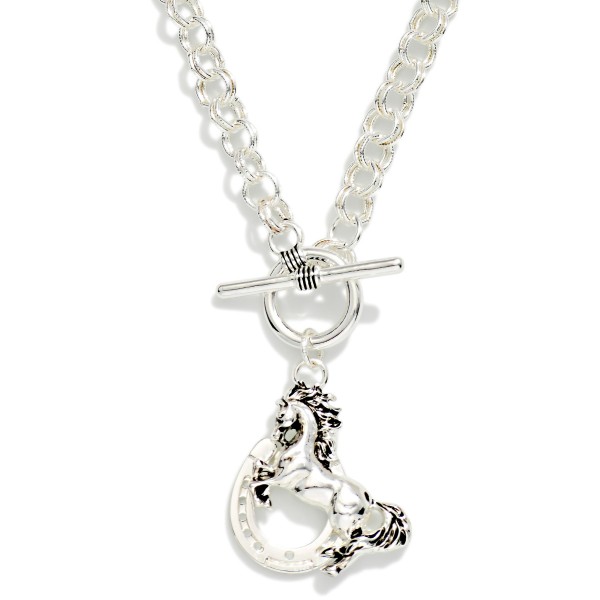 Double Link Chain Link Necklace Featuring Metal Tone Horse & Horseshoe Pendant With Toggle Clasp 

- Approximately 17" L
