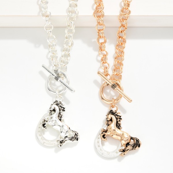 Double Link Chain Link Necklace Featuring Metal Tone Horse & Horseshoe Pendant With Toggle Clasp 

- Approximately 17" L
