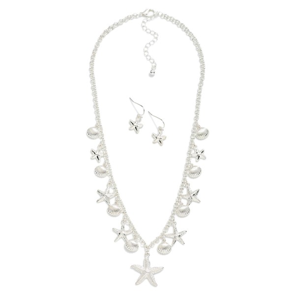 Chain Link Necklace Featuring Metal Tone Starfish & Shell Charms 

- Including Metal Tone Starfish Drop Earrings 
- Approximately 18" L
- Extender 3" L