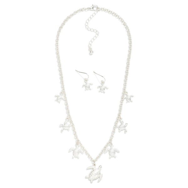 Double Link Chain Link Necklace Featuring Metal Tone Sea Turtle Charms 

- Metal Tone Sea Turtle Drop Earrings 
- Approximately 18" L
- Extender 2" L