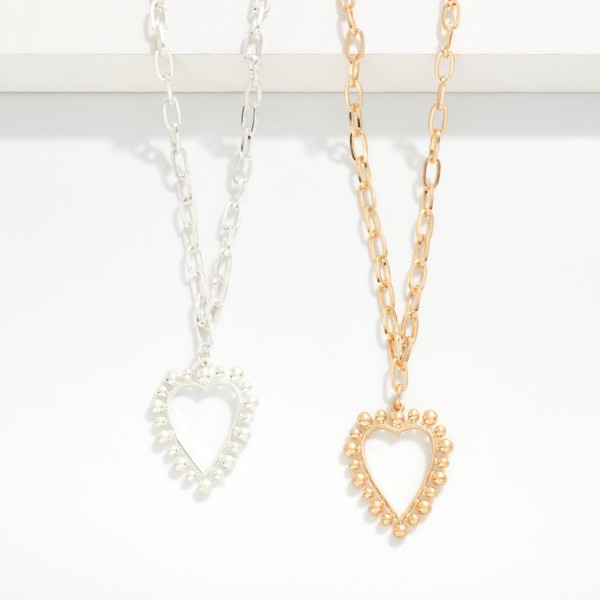 Metal Tone Paperclip Chain Link Necklace Featuring Hollow Heart Pendant 

- Approximately 16" L
- Extender 3" L 