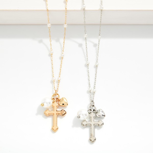 Chain Link Necklace With Pearl Stations Featuring Metal Tone Baroque Cross & Pearl Pendant 

- Approximately 14" L
- Extender 3" L