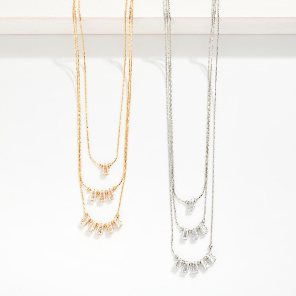 Layered Box Chain Necklace Featuring Baguette Cut Cubic Zirconia Details

- Approximately 16" L
- Extender 3" L
