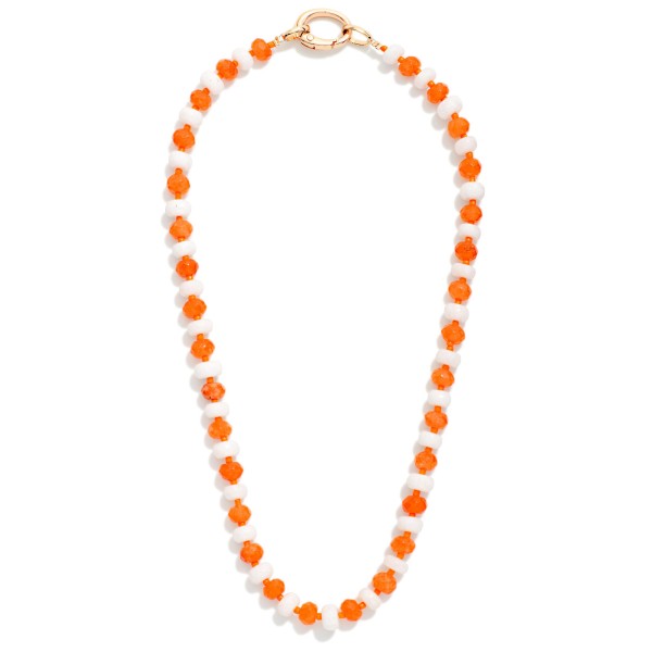 Game Day Faceted Bead Beaded Necklace Featuring Metal Tone Oval Clasp Pendant

- Approximately 16" L