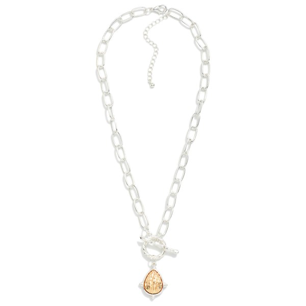 Ribbed Link Chain Link Necklace Featuring Textured Two Tone Teardrop Pendant & Metal Tone Branch Toggle Clasp Detail 

- Approximately 18" L