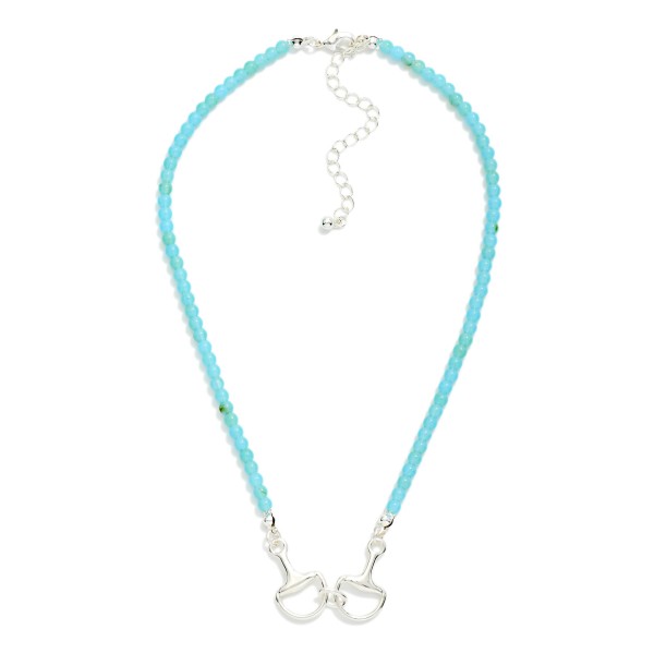 Turquoise Stone Beaded Necklace Featuring Metal Tone Stationary Horsebit Pendant 

- Gold Dipped 
- Approximately 16" L
- Extender 3" L