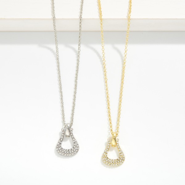 Dainty Crystal Pave Open Teardrop Pendant Necklace. A delicate chain suspends a sparkling open teardrop pendant lined with pave-set crystal rhinestones for all-day shine. Lightweight and comfortable, it layers beautifully with other chains or stands alone as an easy everyday accent. A gift-ready style minimalist jewelry lovers reach for — a boutique display staple that sells through fast.