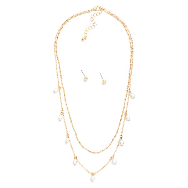 Layered Chain Link Necklace Featuring Pearl Charms 

- Metal Tone Ball Stud Earrings Included
- Approximately 16" L
- Extender 3" L