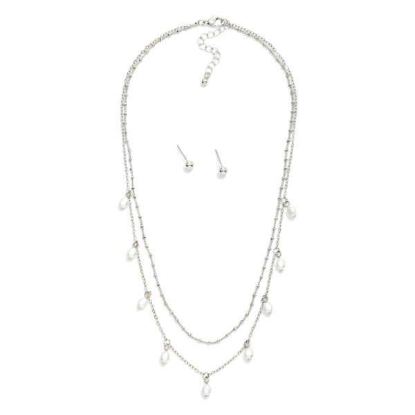 Layered Chain Link Necklace Featuring Pearl Charms 

- Metal Tone Ball Stud Earrings Included
- Approximately 16" L
- Extender 3" L