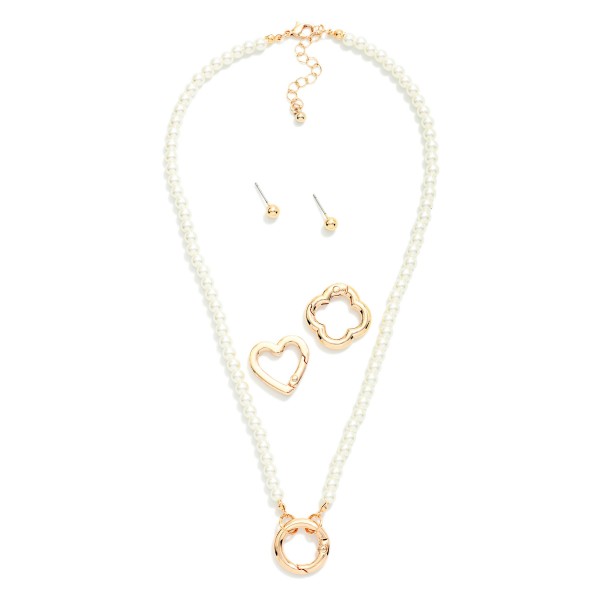 Pearl Beaded Necklace Featuring Interchangeable Metal Tone Clasp

- Includes 3 different clasps- circle, heart, & clover
- Gold Tone Ball Stud Earrings Included 
- Approximately 16" L
- Extender 3" L