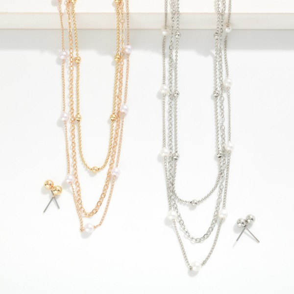 Layered Chain Link Necklace Featuring Pearl Stations 

- Metal Tone Ball Stud Earrings Included
- Approximately 16" L
- Extender 3" L