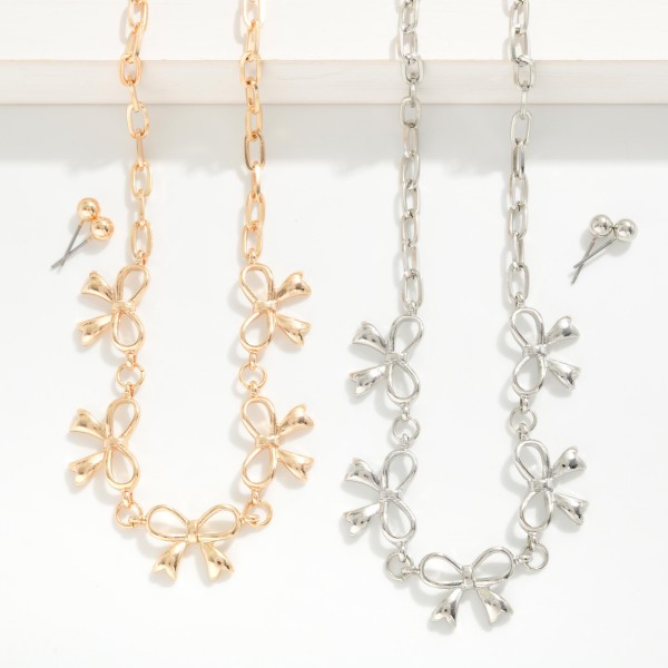 Chain Link Necklace Featuring Metal Tone Bow Stations 

- Metal Tone Ball Studs Included 
- Approximately 14" L
- Extender 3" L
