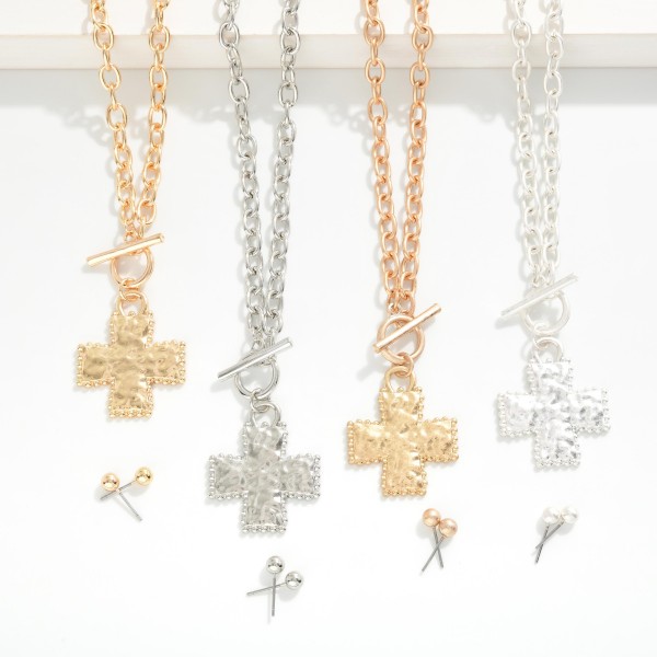 Chain Link Necklace Featuring Hammered Metal Plus Cross & toggle Clasp Pendant

- Includes Metal Tone Ball Stud Earrings 
- Approximately 16" L
