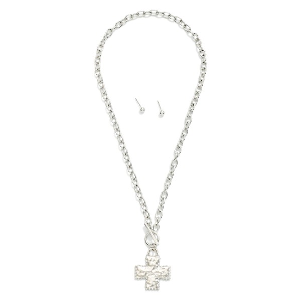 Chain Link Necklace Featuring Hammered Metal Plus Cross & toggle Clasp Pendant

- Includes Metal Tone Ball Stud Earrings 
- Approximately 16" L
