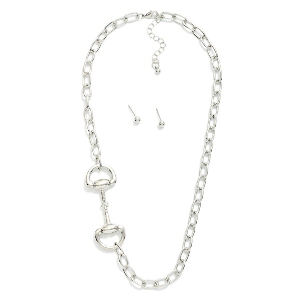 Chain Link Necklace Featuring Metal Tone Horsebit Stationary Pendant 

- Metal Tone Ball Stud Earrings 
- Approximately 18" L
- Extender 3" L