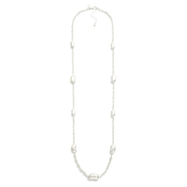 Long Chain Link Necklace Featuring Metal Tone Bean Stations 

- Approximately 36" L
- Extender 3" L