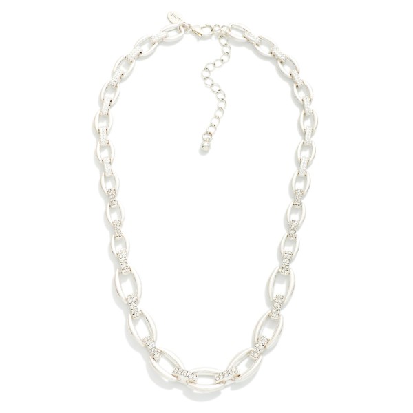 Metal Tone Graduated Link Necklace Featuring Rhinestone Links 

- Approximately 16" L
- Extender 3" L
