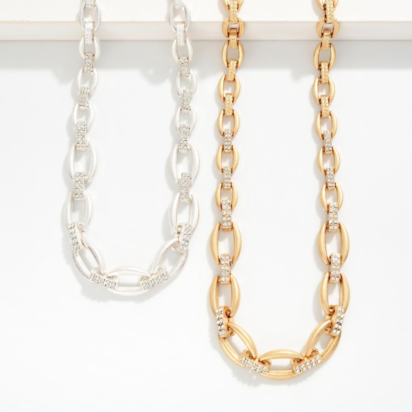 Metal Tone Graduated Link Necklace Featuring Rhinestone Links 

- Approximately 16" L
- Extender 3" L