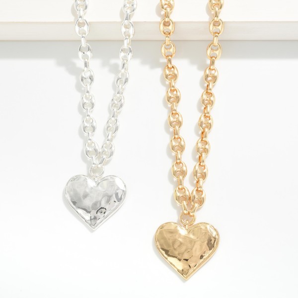 Pig Nose Chain Link Necklace Featuring Hammered Metal Heart Pendant 

- Approximately 16" L
- Extender 3" L