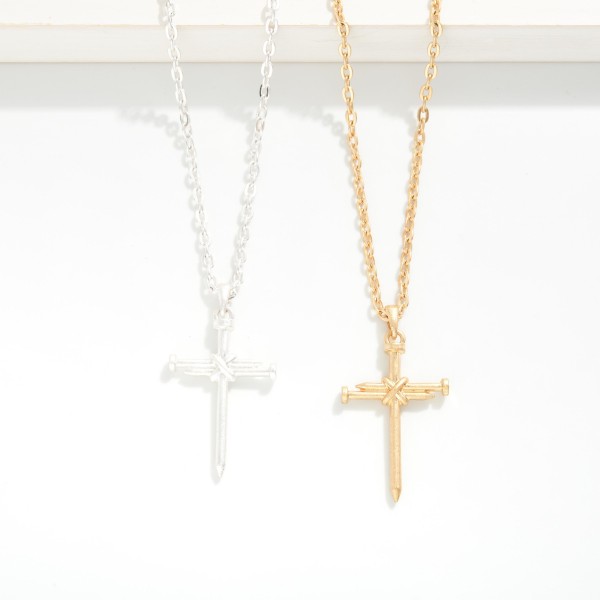Chain Link Necklace Featuring Metal Tone Nail Cross Pendant 

- Approximately 16" L
- Extender 3" L