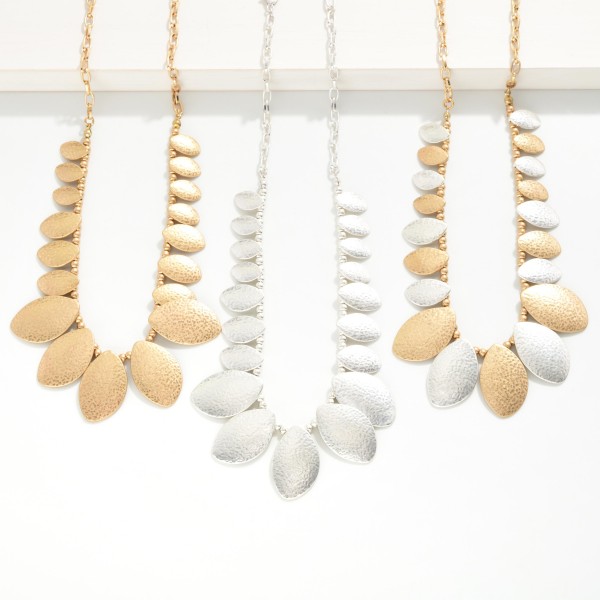 Metal Tone Beaded Chain Link Necklace With Hammered Metal Ovate Charms 

- Approximately 16" L
- Extender 3" L