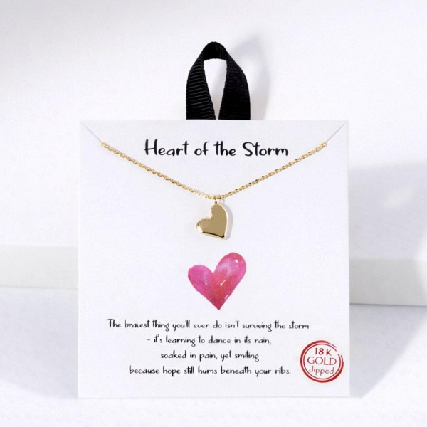 Dainty Chain Link Necklace Featuring Metal Tone Heart Pendant 

- Gold Dipped
- Hypoallergenic Brass Base
- Approximately 16" L
- Extender 2" L
- Made in Korea
- Lead & Nickel Free

Card Reads : "The bravest thing you'll ever do isn't surviving the storm- it's learning to dance in its rain, soaked in pain, yet smiling because hope still hums beneath your ribs."

