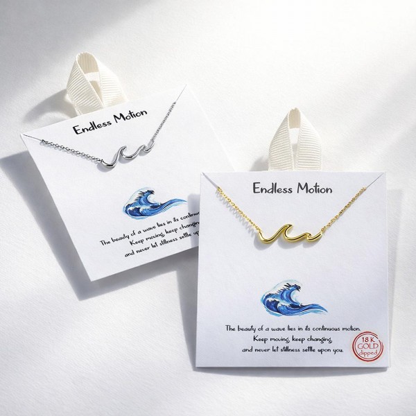 Dainty Chain Link Necklace Featuring Metal Tone Wave Stationary Pendant 

- Approximately 16" L
- Extender 2" L
- Hypoallergenic Brass Base
- 18K Gold Dipped
- Card: "The beauty of a wave lies in its continuous motion. Keep moving, keep changing, and never let stillness settle upon you."