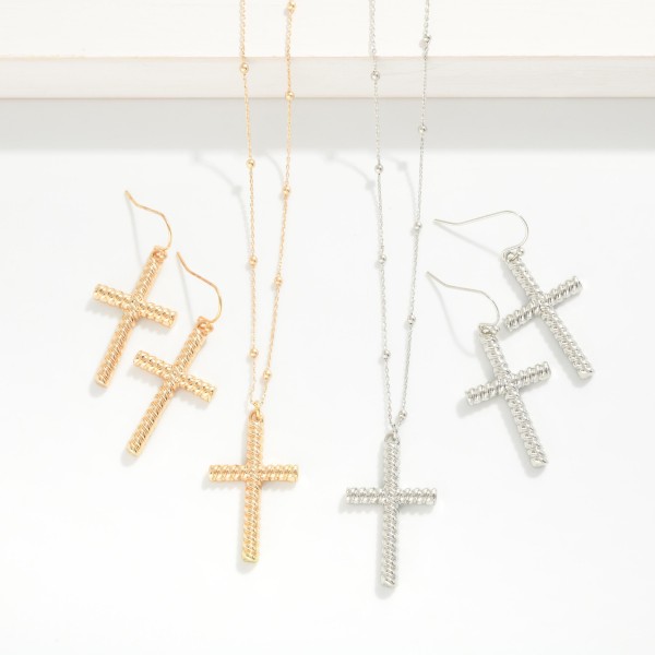 Chain Link Necklace Featuring Metal Tone Ball Stations With Twisted Metal Cross Pendant

- Twisted Metal Cross Drop Earrings Included 
- Approximately 16" L
- Extender 3" L