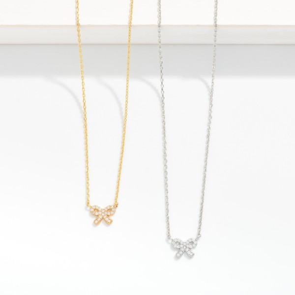 Dainty Chain Link Necklace Featuring Cubic Zirconia Bow Pendant

- Gold Dipped
- Approximately 15.5" L
- Extender 2" L