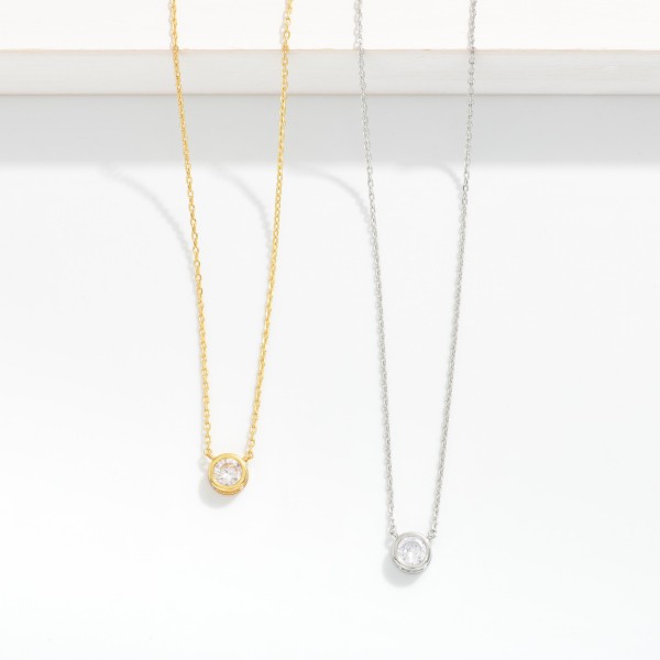 Dainty Chain Link Necklace Featuring Cubic Zirconia Circle With Metal Tone Border Pendant

- Gold Dipped
- Approximately 15.5" L
- Extender 2" L