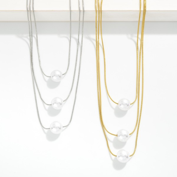 Layered Snake Chain Necklace Featuring Pearl Stationary Pendants 

- Stainless Steel 
- Water Resistant
- Approximately 16" L