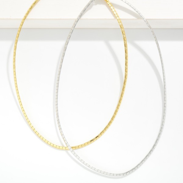 Metal Tone Square Link Chain Link Necklace 

- Stainless Steel 
- Water Resistant 
- Approximately 15.5" L
- Extender 2" L