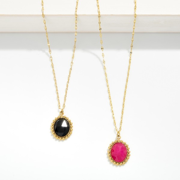 Dainty Lip Chain Necklace Featuring Faceted Acetate Oval Pendant With Metal Tone Studded Border 

- Stainless Steel 
- Water Resistant 
- Approximately 15.5" L
- Extender 2" L 
