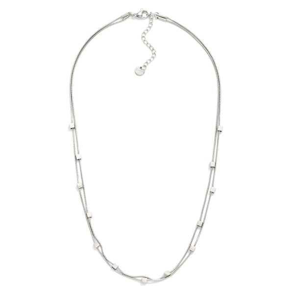 Layered Snake Chain Necklace Featuring Metal Tone Square Stations 

- Stainless Steel 
- Water Resistant 
- Approximately 14" L
- Extender 2" L