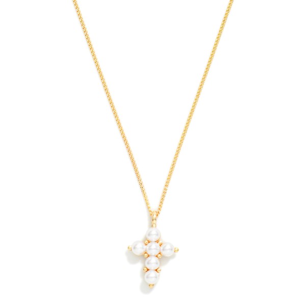 Pearl Cross Pendant Necklace featuring a delicate cross formed from petite faux pearls set in polished prong settings, hanging from a fine curb chain. Soft luster and a classic silhouette make it a graceful everyday piece that also feels special enough for church and celebrations. A beautiful gift for baptisms, first communions, confirmations, brides, and Easter. Pearl and cross styles are two proven categories in one, so this design sells steadily all year.