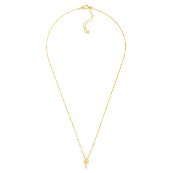Dainty Pearl Station Cross Necklace featuring a tiny polished cross pendant framed by petite faux pearl stations along a fine, delicate chain. An adjustable extender lets it sit right at the collarbone, perfect on its own or layered with longer chains. A meaningful gift for baptisms, first communions, confirmations, and Easter. Subtle, sweet, and easy to wear daily, faith pieces like this sell steadily all year.