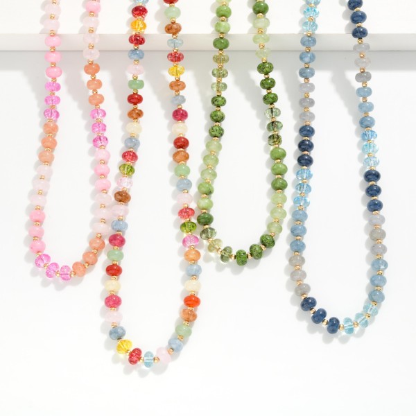 Faceted Rondelle Bead Necklace strung with a mix of sparkling glass crystal beads, finished with tiny metal spacers and a lobster clasp with extender. The faceted beads catch the light from every angle for an easy dose of shine. Great for layering with chains or wearing alone for holiday parties and everyday outfits. A beaded staple that sells in multiples when merchandised as a set.