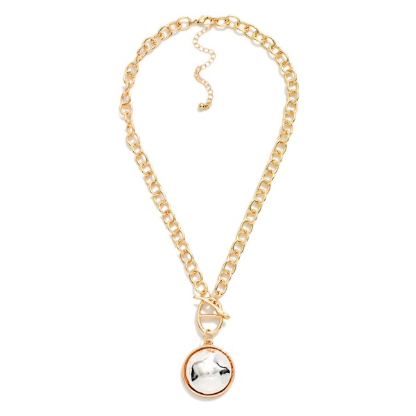 Two Tone Dome Pendant Necklace with a polished round medallion framed in a contrasting metal bezel, hung from a front toggle on a chunky rolo chain. The bold chain and smooth dome strike the right balance between statement and everyday, with an extender to adjust the length. Easy to style with sweaters, tees and dresses all season. Mixed metal pieces like this are a quick sell for boutiques at a friendly price.