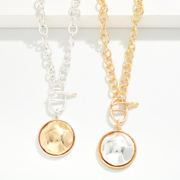 Two Tone Dome Pendant Necklace with a polished round medallion framed in a contrasting metal bezel, hung from a front toggle on a chunky rolo chain. The bold chain and smooth dome strike the right balance between statement and everyday, with an extender to adjust the length. Easy to style with sweaters, tees and dresses all season. Mixed metal pieces like this are a quick sell for boutiques at a friendly price.
