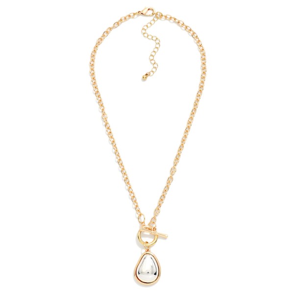Two Tone Teardrop Pendant Necklace with a polished domed drop framed in a contrasting metal bezel, hung from a front toggle on a textured cable chain. The mixed metal look pairs easily with any jewelry already in her collection, and the extender adjusts the length. A clean everyday piece for workwear, weekends and gifting. Mixed metal styles are a top request, and this one comes in at an easy price.