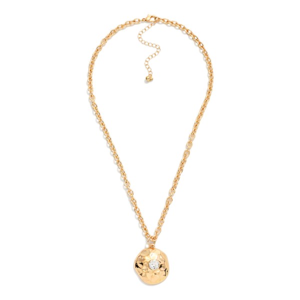 Hammered Disc Pendant Necklace with a polished coin charm set with a sparkling crystal accent on a classic rolo chain. The organic hammered texture catches the light from every angle, and the extender makes the length easy to adjust. A simple everyday layering piece that works for gifting, workwear and weekends. An easy price point that turns browsers into buyers at the jewelry wall.